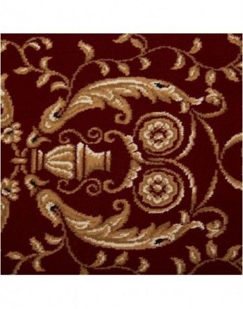 A red rug with a gold pattern on it