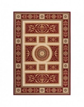 A red and white rug with a circular design on it