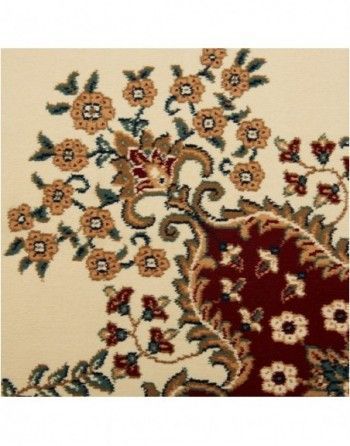 A close up of a rug with flowers and leaves on it