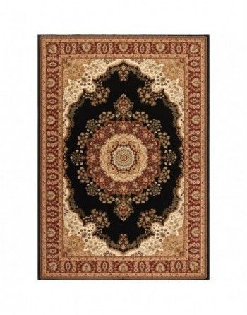 A black rug with a circular design on it