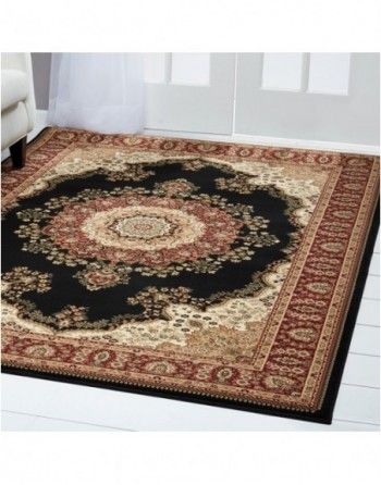 A rug with a circular design is on the floor in a living room