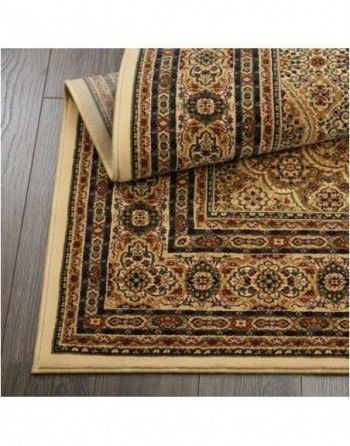 A rug is rolled up on a wooden floor