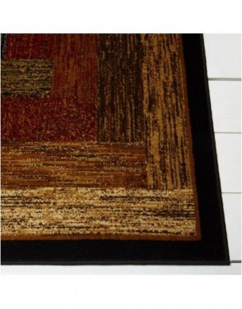 A rug with a wood grain pattern and a black border