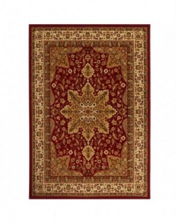 A red and gold rug with a floral pattern on a white background.