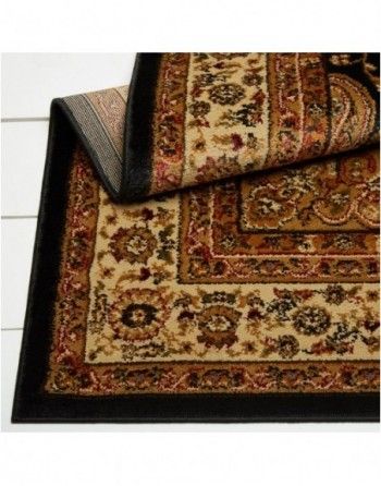 A rug with a black border and a floral pattern