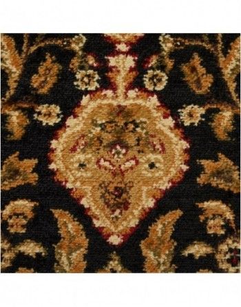A black rug with a floral pattern on it