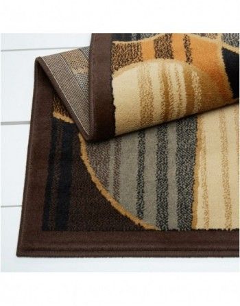 A rug with a brown border is laying on a table