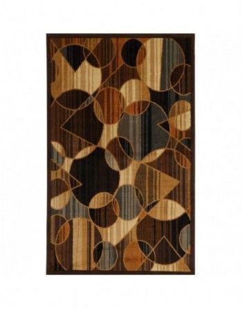 A brown rug with a geometric pattern on it