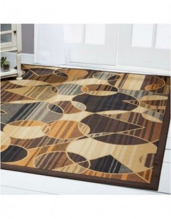 A rug with a geometric pattern is on the floor in a living room