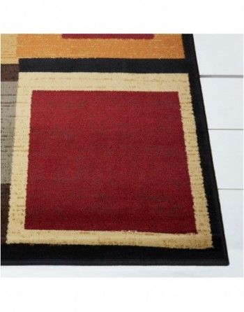 A red and black rug with a black border