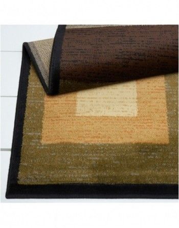 A rug with a black border is laying on a table.