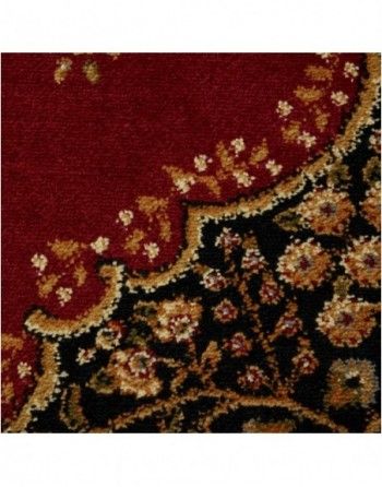 A close up of a red and black rug with flowers on it