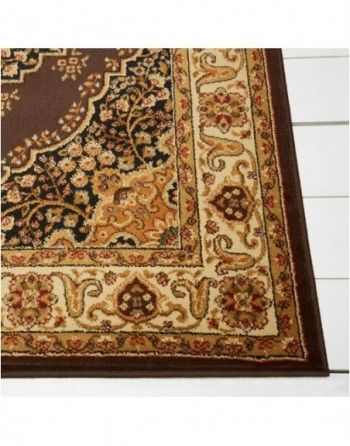 A rug with a floral pattern on it is on a wooden floor