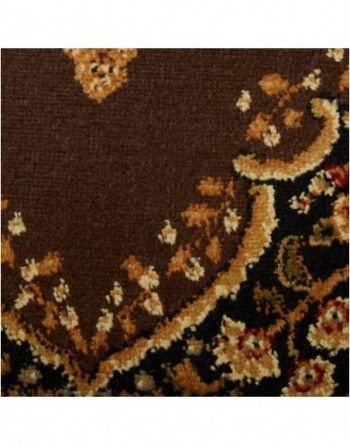 A close up of a brown rug with a floral pattern