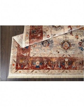 A rug is sitting on top of a wooden floor.