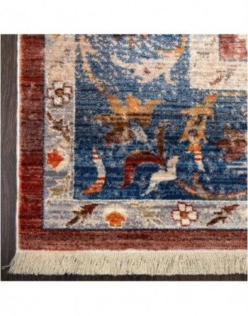 A close up of a rug with a floral design on it.