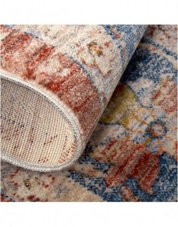 A close up of the back of a rug with a floral pattern.