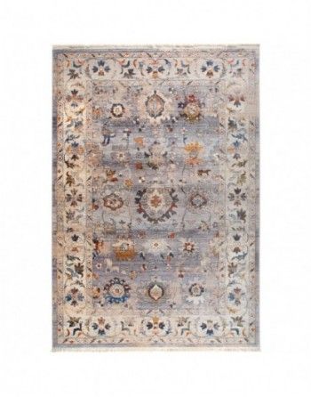 A rug with a floral pattern on it is on a white background.
