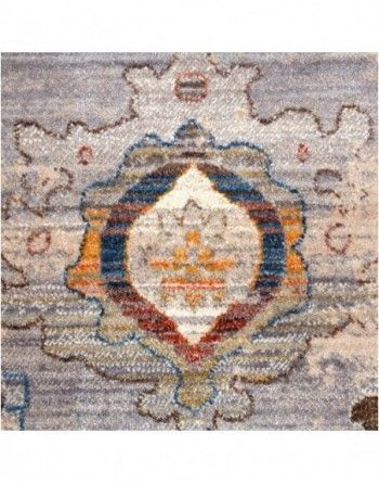 A close up of a rug with a floral pattern on it.