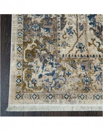A rug with a floral pattern is sitting on a wooden floor.