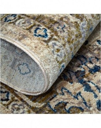 A close up of a rug with a floral pattern on it.