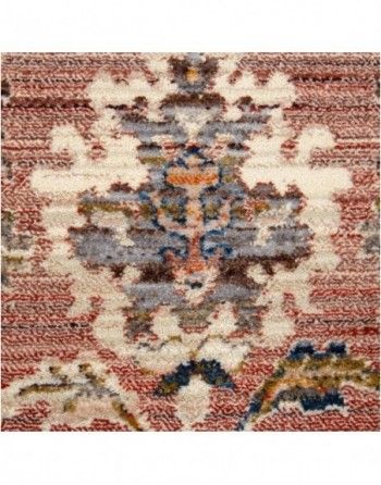 A close up of a rug with a floral pattern on it.