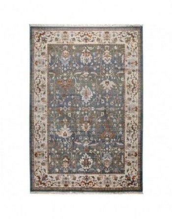 A rug with a floral pattern on it is on a white background.