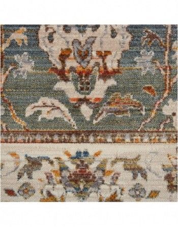 A close up of a rug with a floral pattern on it.