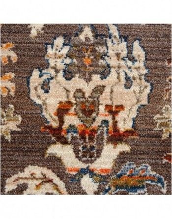 A close up of a rug with a floral pattern on it.