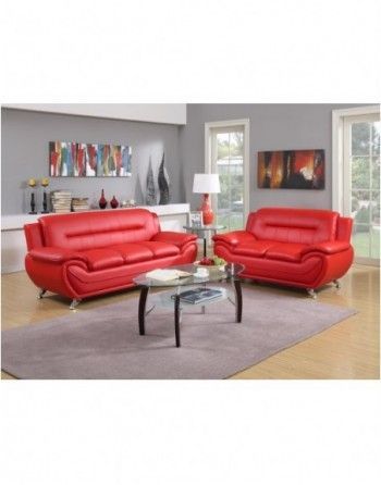 A living room with two red couches and a coffee table