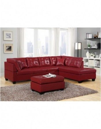 A living room with a red sectional couch and ottoman.