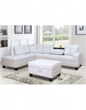 A living room with a white sectional couch and ottoman.