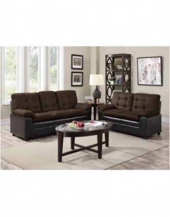 A living room with two brown couches and a coffee table