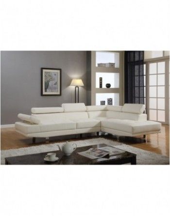 A living room with a white sectional couch and a coffee table