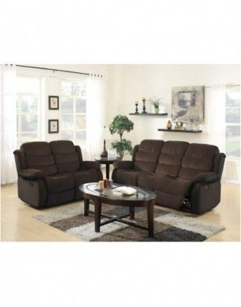 A living room with two brown couches and a coffee table.