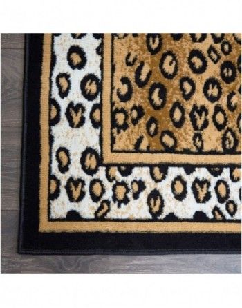 A leopard print rug with a black border