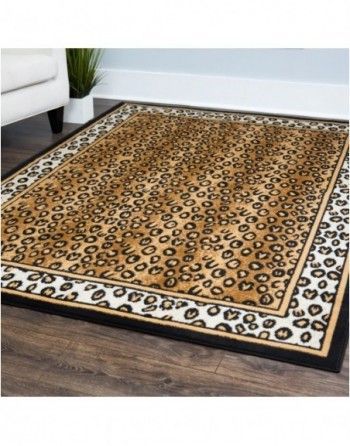 A leopard print rug is sitting on a wooden floor in a living room.