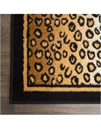 A close up of a leopard print rug on a wooden floor