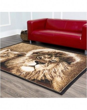 A living room with a red couch and a rug with a lion on it.
