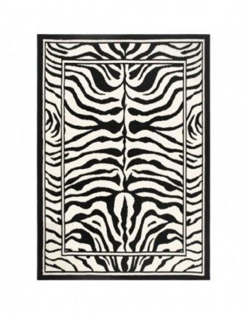 A black and white rug with a zebra print on it.