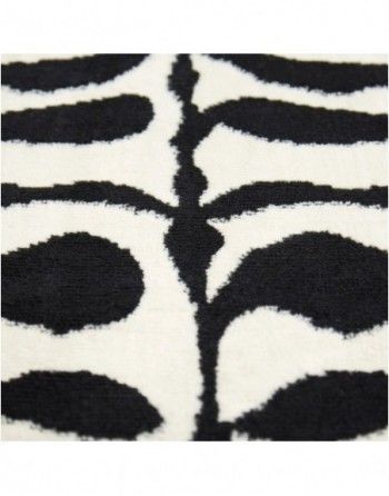 A close up of a black and white zebra print rug