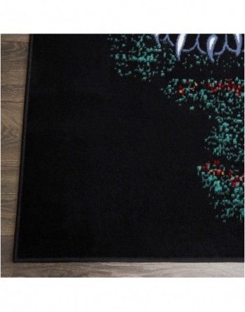 A black rug with a christmas tree on it