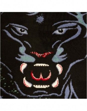 A close up of a black panther 's face with red teeth