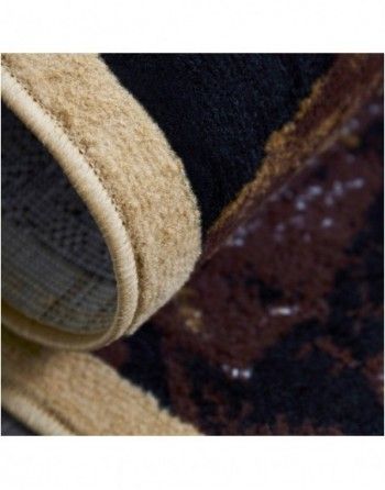 A close up of a black and brown rug with a beige border.