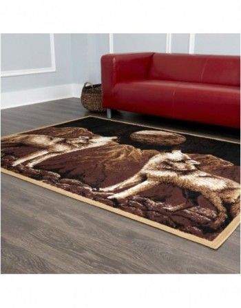 A living room with a red couch and a rug on the floor