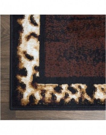 A rug with a leopard print on it is on a wooden floor.