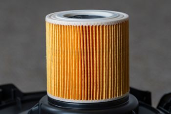 a close up of a filter on top of a vacuum cleaner