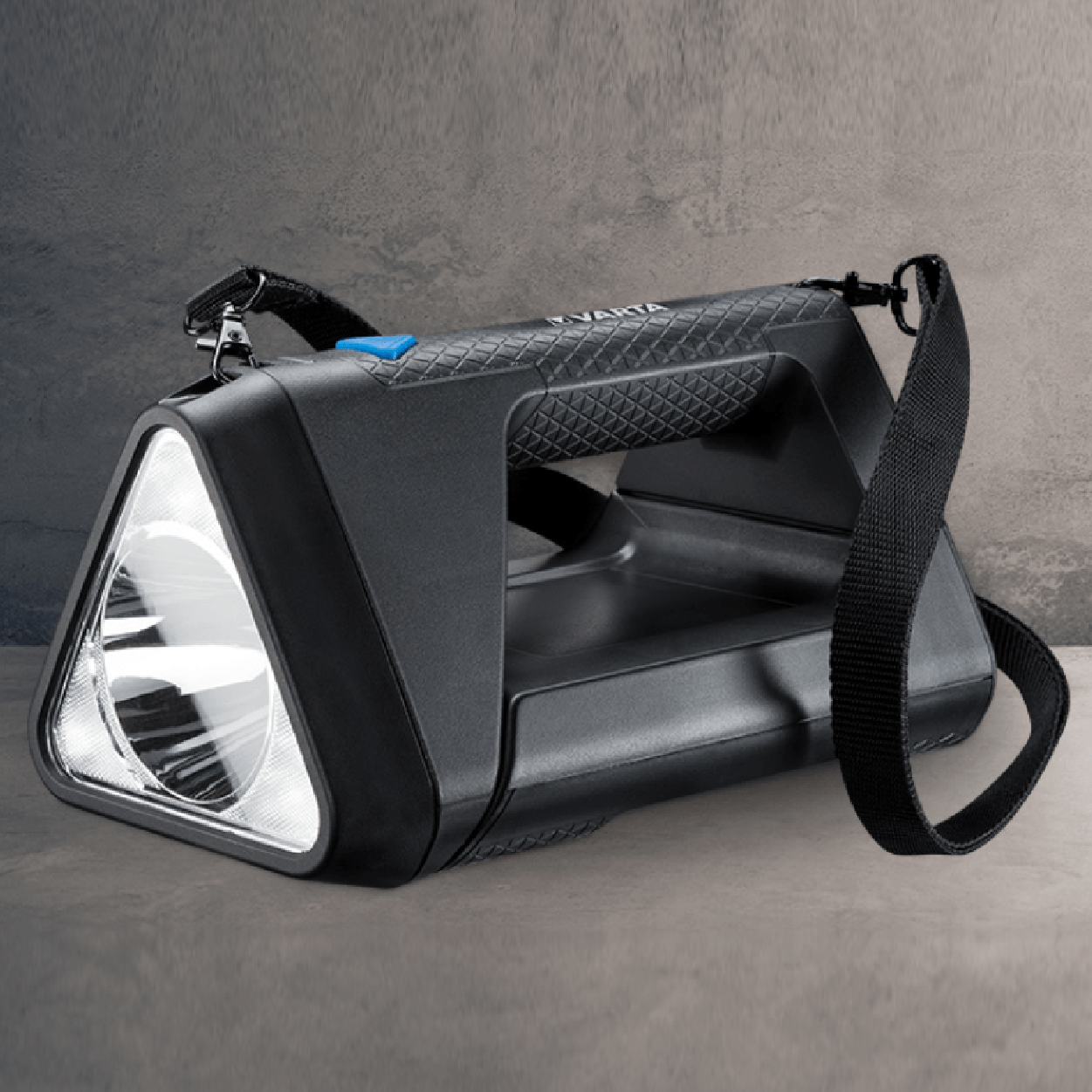 Black, triangular flashlight with a shoulder strap, on a neutral backdrop.