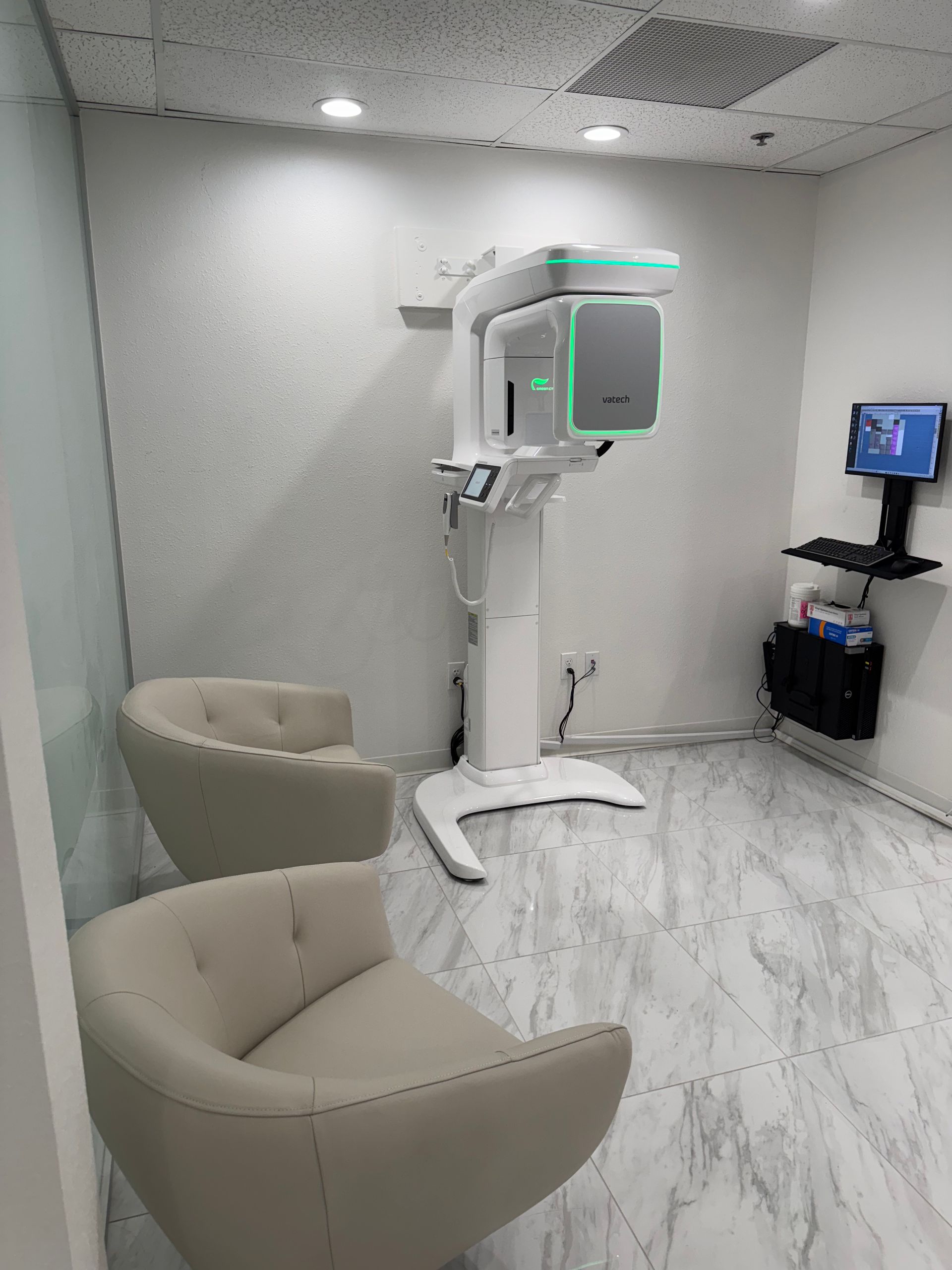 A room with two chairs and a machine in it