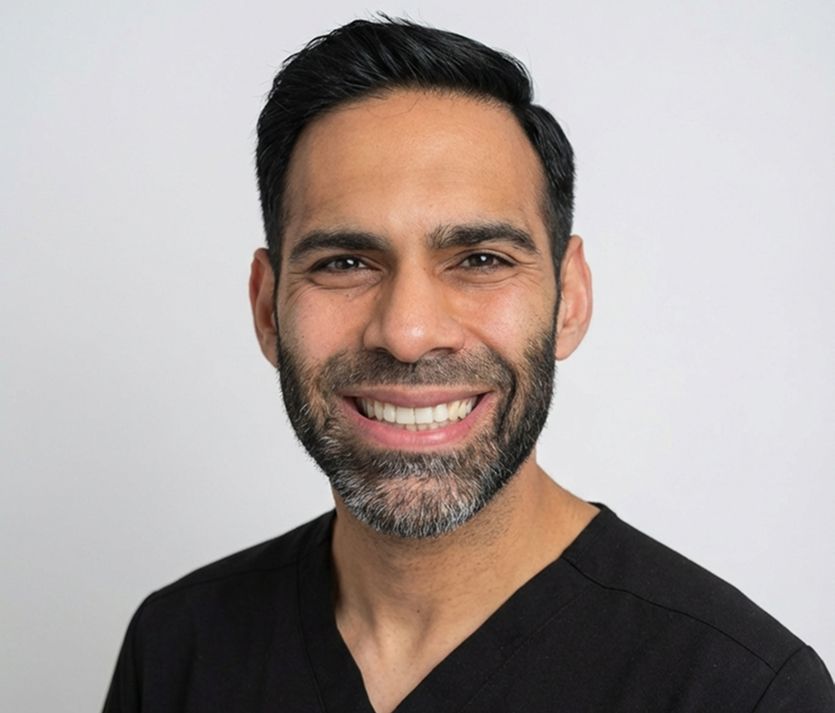 A group of people are looking at a woman 's smile in a mirror